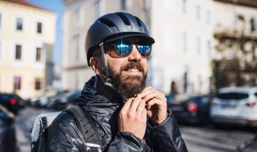 male-courier-with-sunglasses-delivering-packages-i-4FB9L3D.jpg